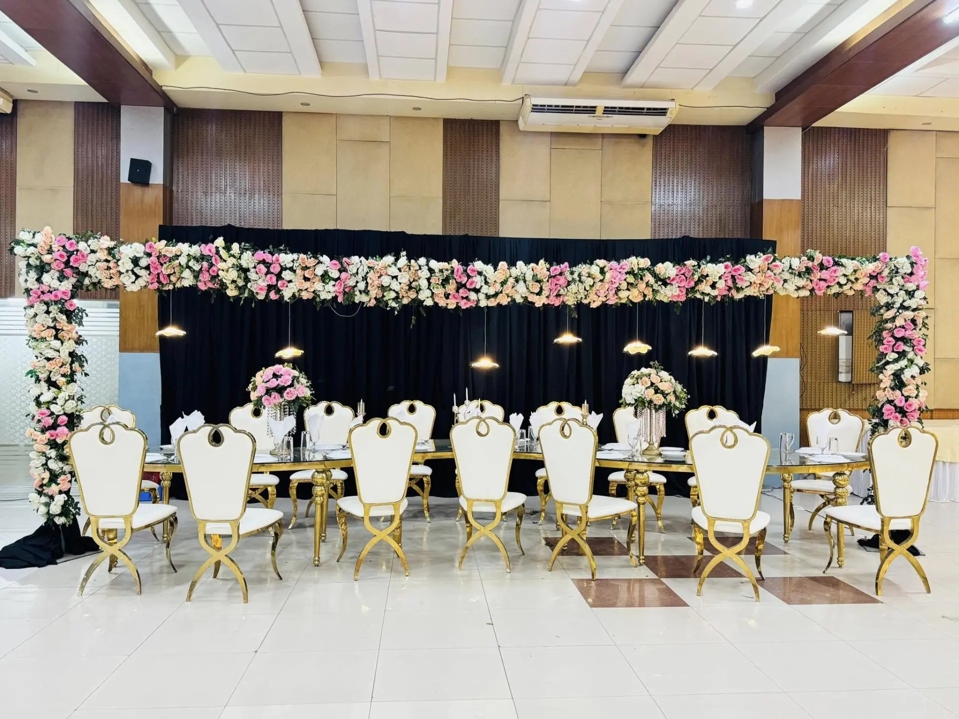 Family dining table with floral frame and gold chairs