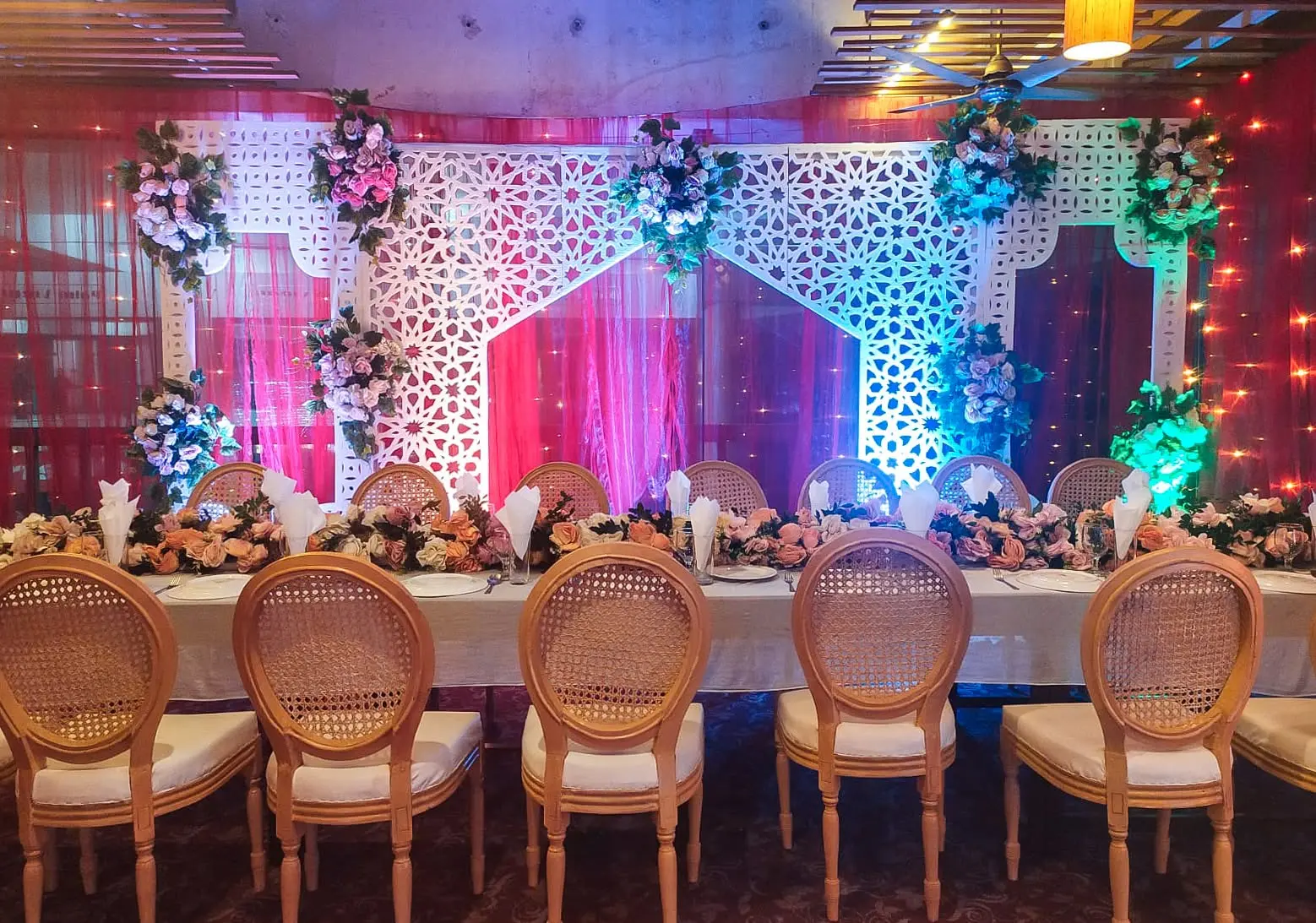 Lattice stage backdrop with floral head table