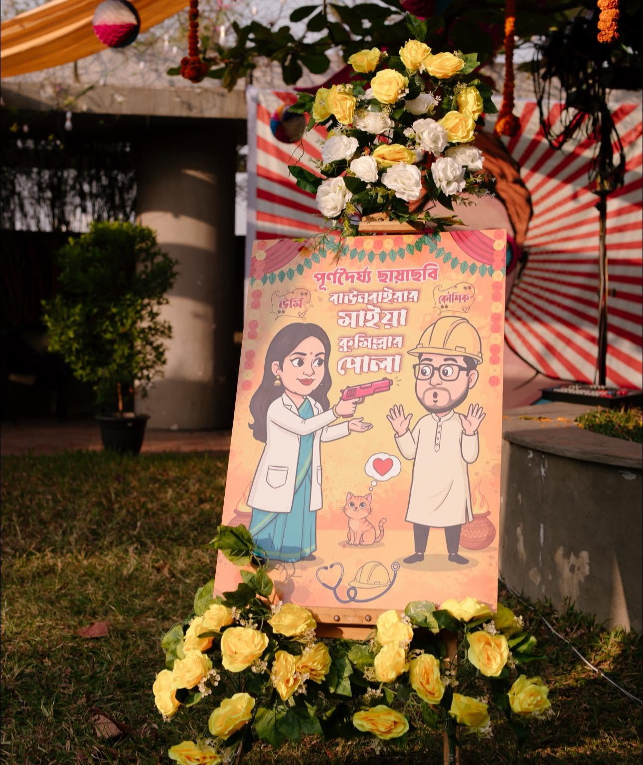 Custom Bangla caricature welcome signage framed with yellow roses