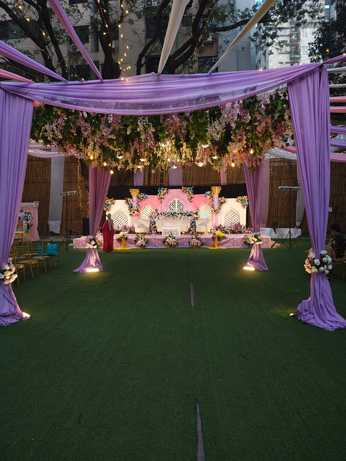 Lavender draped canopy with hanging florals