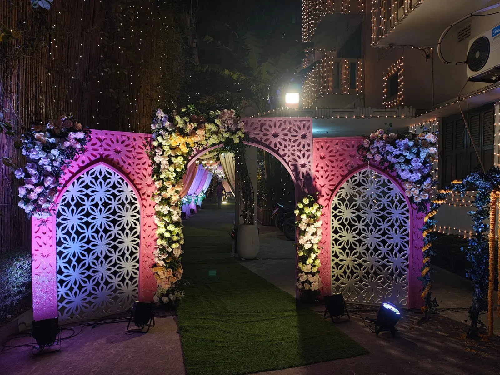 Illuminated floral entrance arches