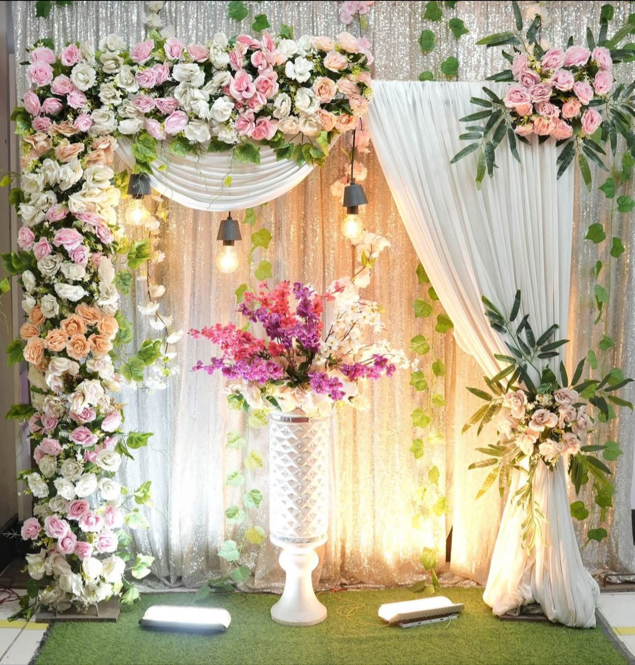 Pink and white floral photo corner with sequin backdrop