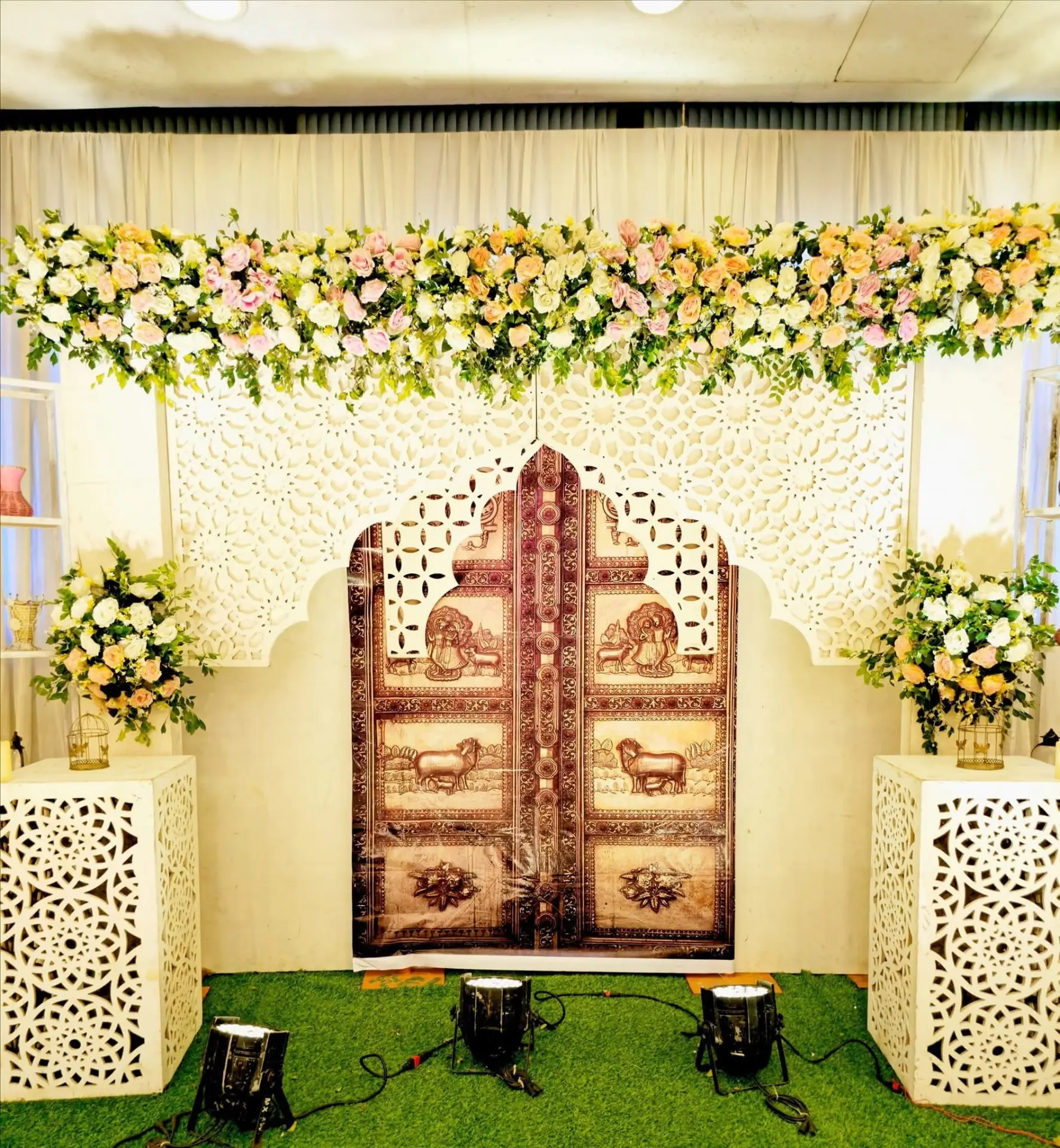 Carved jharokha backdrop with floral valance